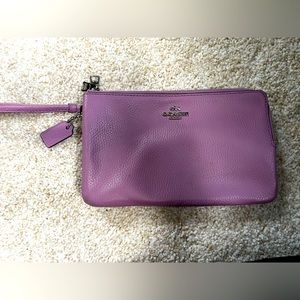 Double zipper Coach wristlet. Large enough pockets to hold your iPhone/Android!